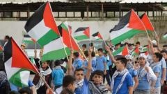 Pictures - Palestinian schools win Jerusalem by raising the flag