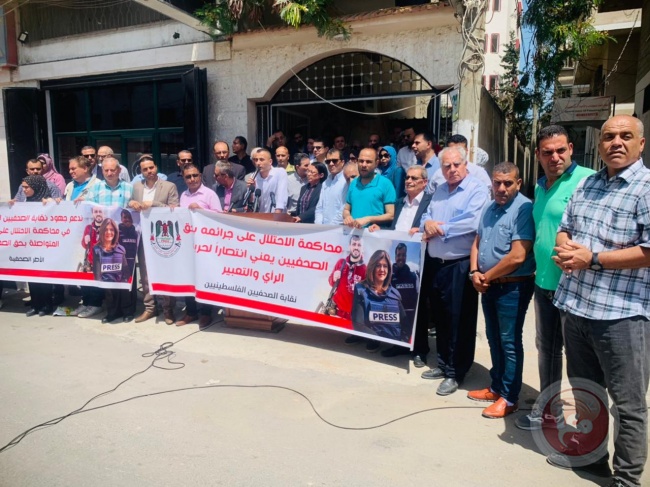 Dozens of journalists participate in a sit-in to prosecute the occupation for its crimes