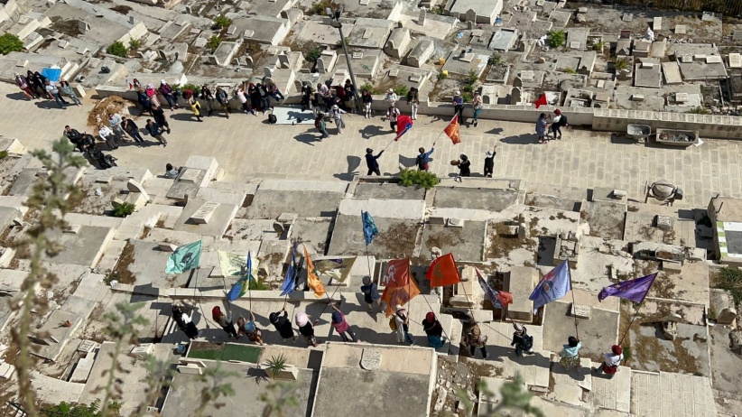 Settlers and tourists perform prayers and dances at Bab al-Rahma cemetery