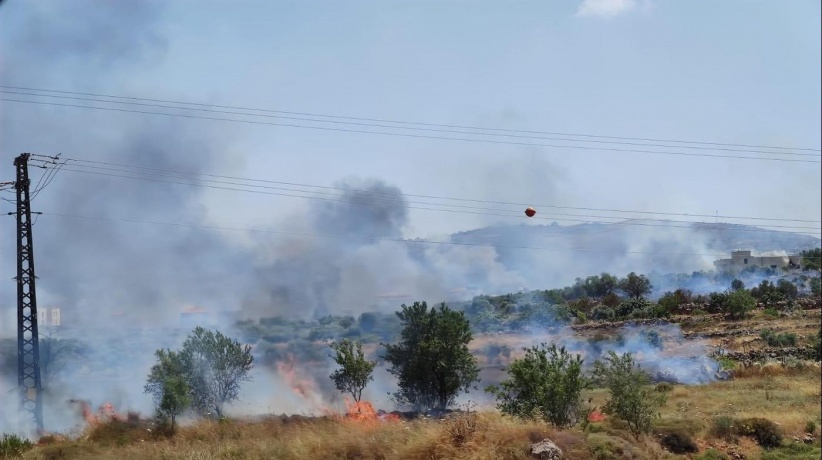 Clashes.. Settlers set fire to land in Husan village